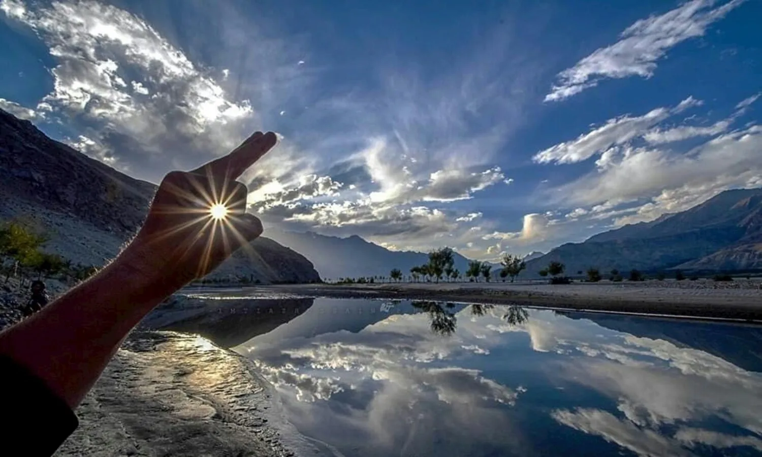 Skardu Valley Tour Package - 10 Days Gilgit Baltistan Adventure Sunset over a serene alpine lake near Fairy Meadows, Northern Pakistan